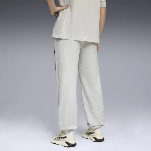  Pánske tepláky PUMA M GRAPHIC FRENCH TERRY JOGGER 52770304 SVETLOSIVÝ VRES 