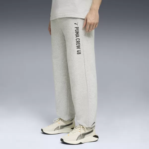  Pánske tepláky PUMA M GRAPHIC FRENCH TERRY JOGGER 52770304 SVETLOSIVÝ VRES 
