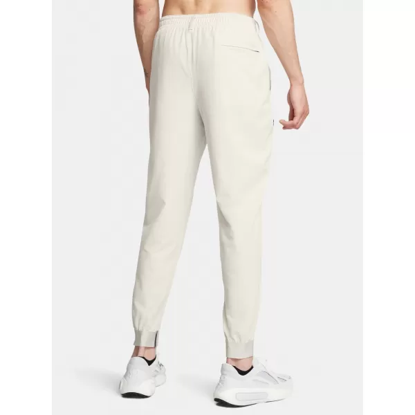  Pánske tepláky UNDER ARMOUR UNSTOPPABLE JOGGERS 1388823-110 BIELA 