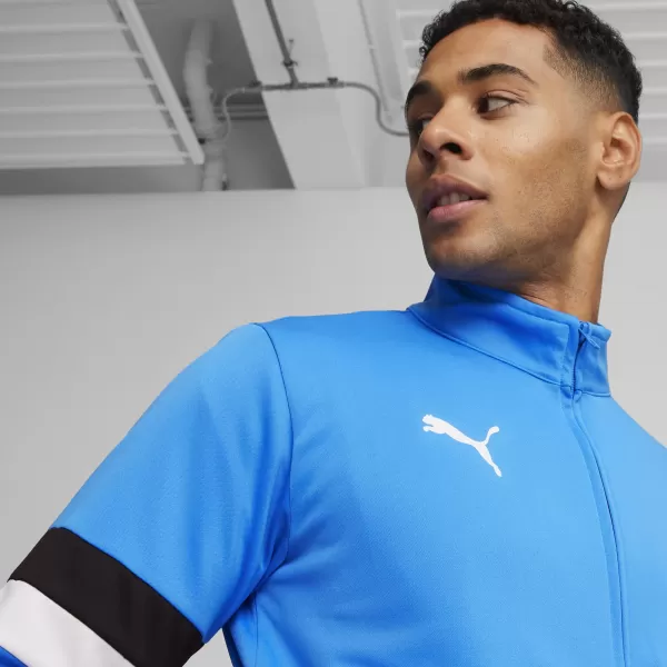  Pánska tepláková súprava PUMA TEAMRISE TRACKSUIT 658653_02 IGNITE BLUE/ IGNITE BLUE/PUMA BLACK 
