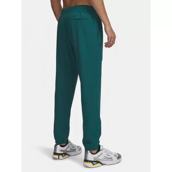  Pánske tepláky UNDER ARMOUR VIBE WOVEN JOGGER 1386557-338 ZELENÁ 