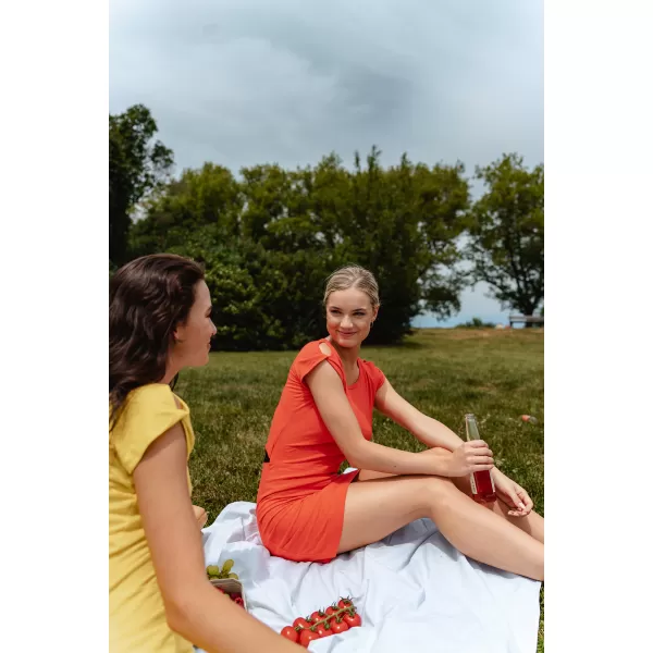  Dámske šaty NORDBLANC WAISTLINE NBSLD7805 ORANŽOVÝ ATRAMENT 