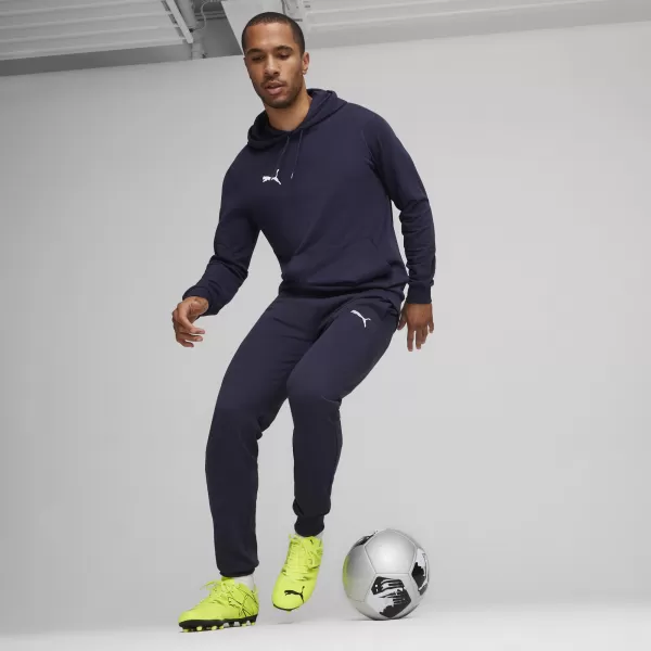  Nohavice PUMA TEAMGOAL CASUALS PANTS 658598_06 PUMA NAVY/PUMA WHITE 