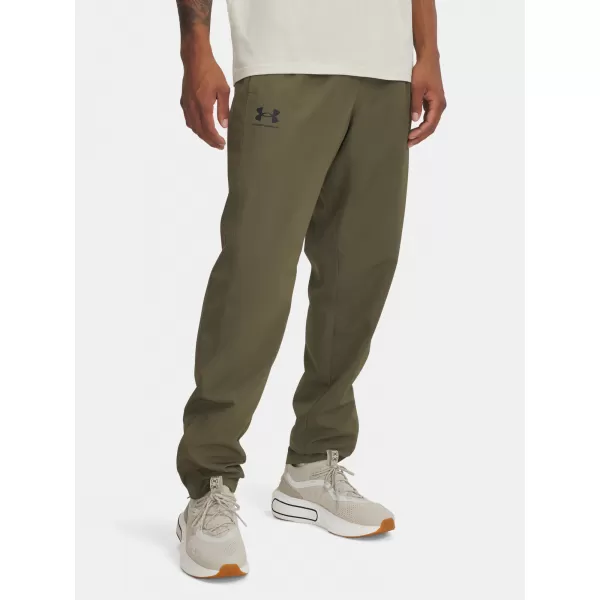  Pánske športové nohavice UNDER ARMOUR RIVAL WVN WINDBREAKER PN 1390150-390 ZELENÁ 